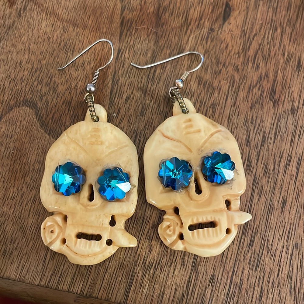 bone skull earrings with rhinestone eyes